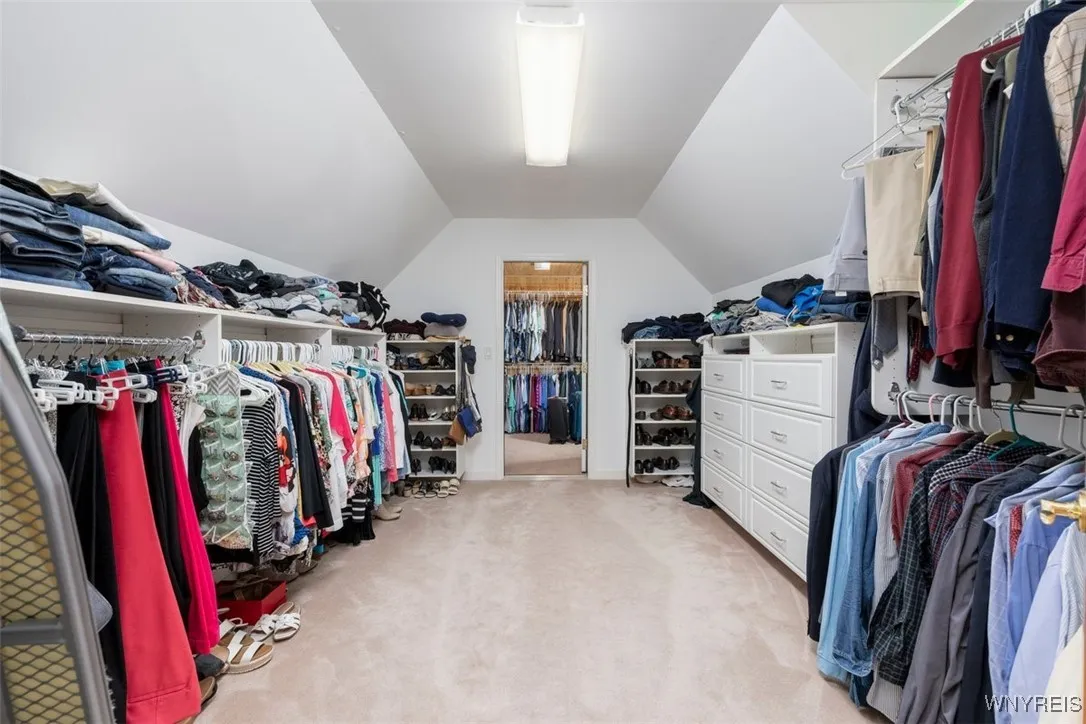 Walk-in closet off owners bathroom, with extended cedar closet area at rear.