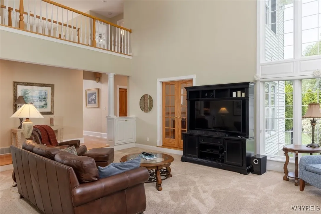Family room opens into office via French doors. Upstairs overlook.