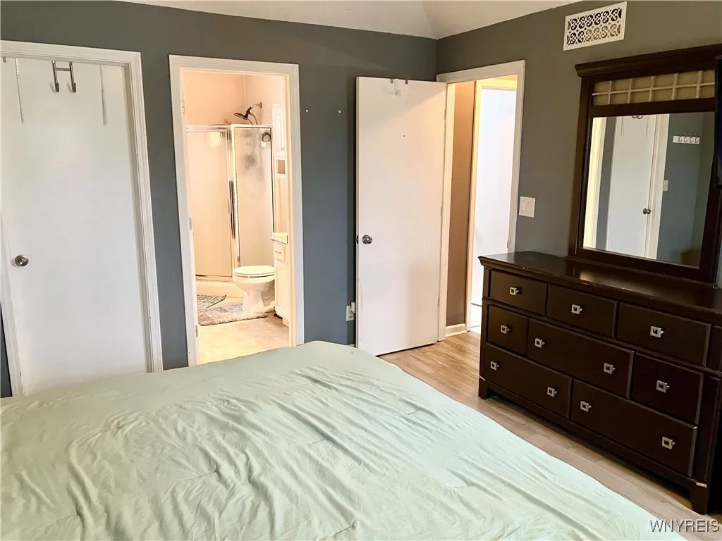 Large primary bedroom with ensuite bath and walk in closet