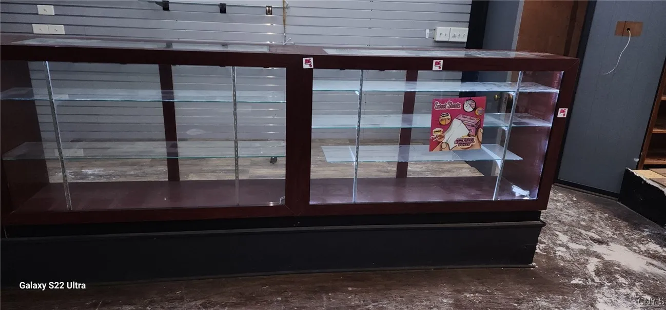 Display Case - 4.  The door in the right background leads to the basement stairs.  Further right is the service counter.