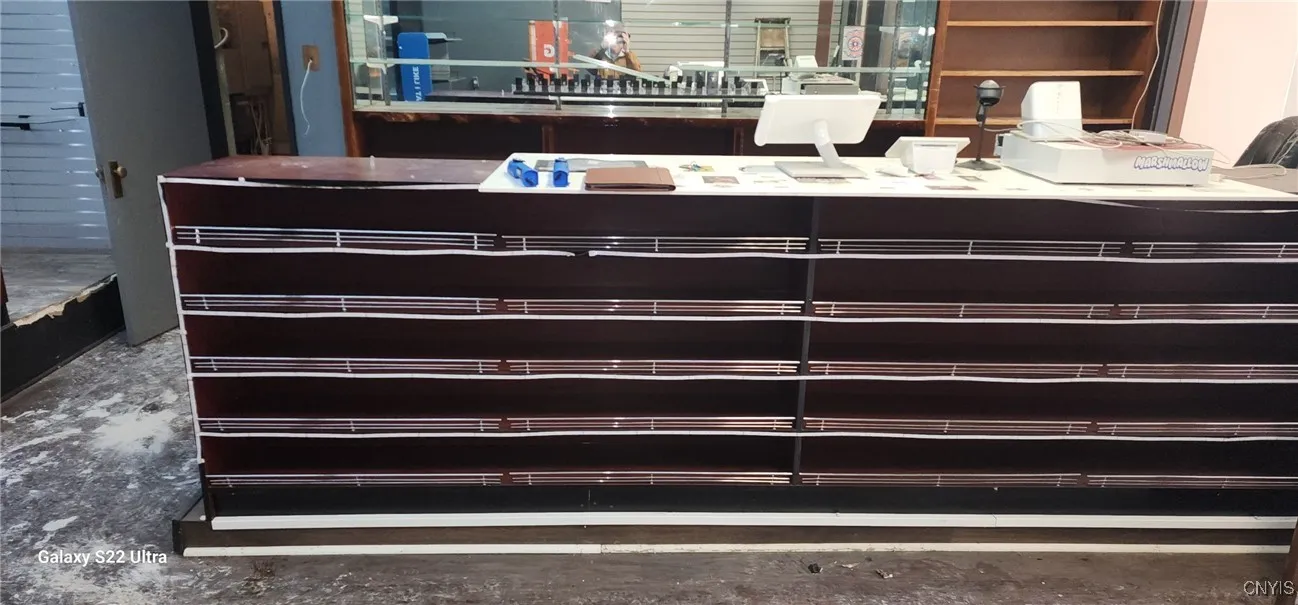 Service counter - 1.  The door in the left background leads to the basement stairs.