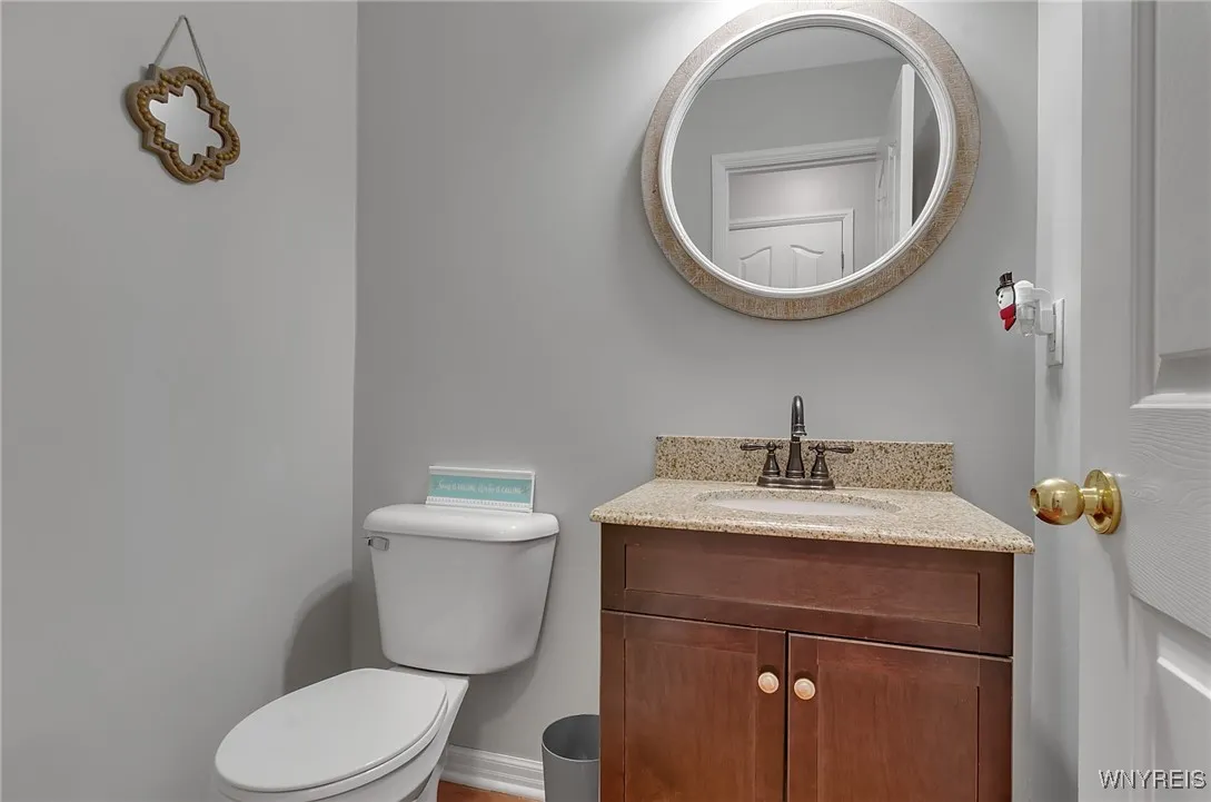 Main floor half bath conveniently located in hallway between foyer and kitchen