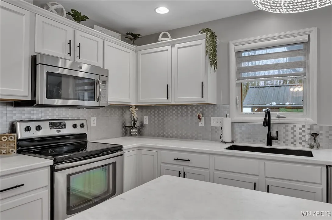 Easy to clean backsplash and an over the stove microwave