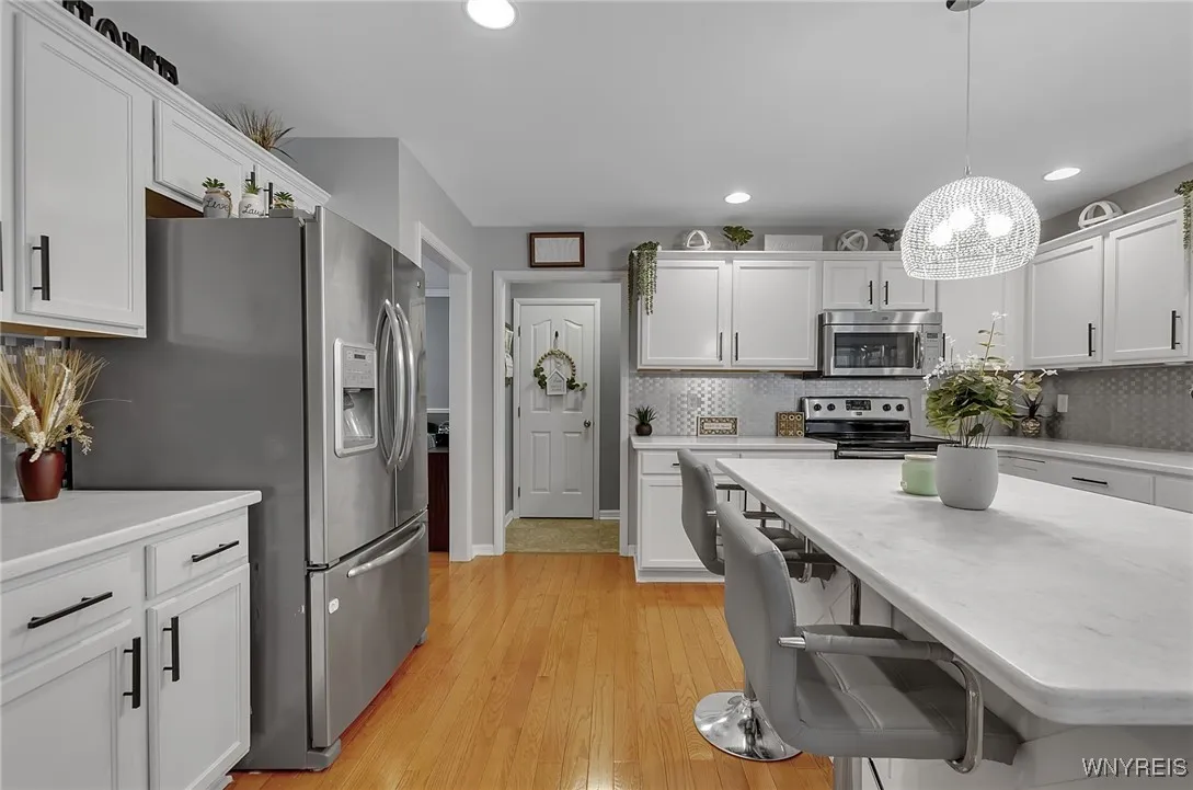 End of kitchen leads to a walk-in pantry and separate laundry room