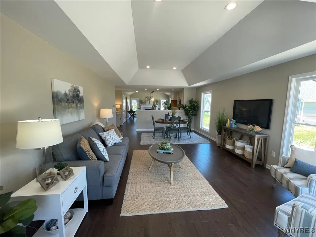 Spacious Living room / dining room combo with tray ceiling