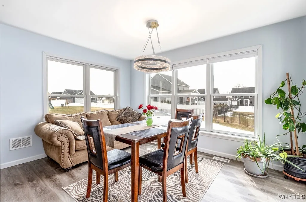 Sunroom off kitchen with sliding glass door to fully fenced back yard.