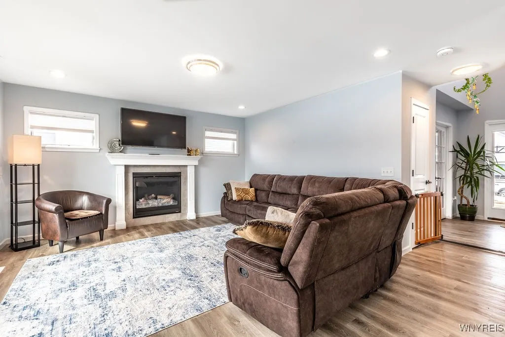 Great room with tons of natural light with gas fireplace
