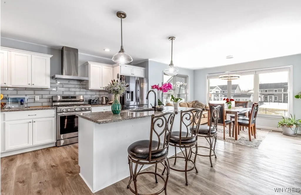 Beautiful large kitchen with granite countertops and ceramic back splash