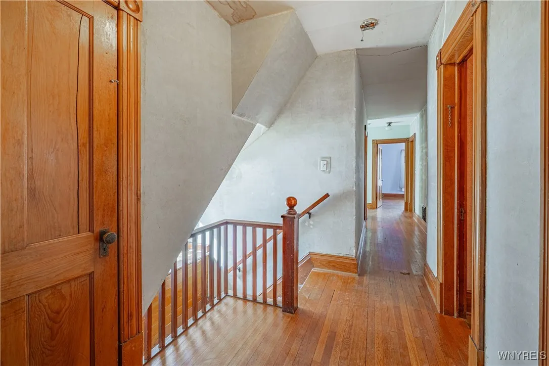 Back staircase, was removed on 1st floor to make room for pantry, can be reinstalled. Attic door to left.