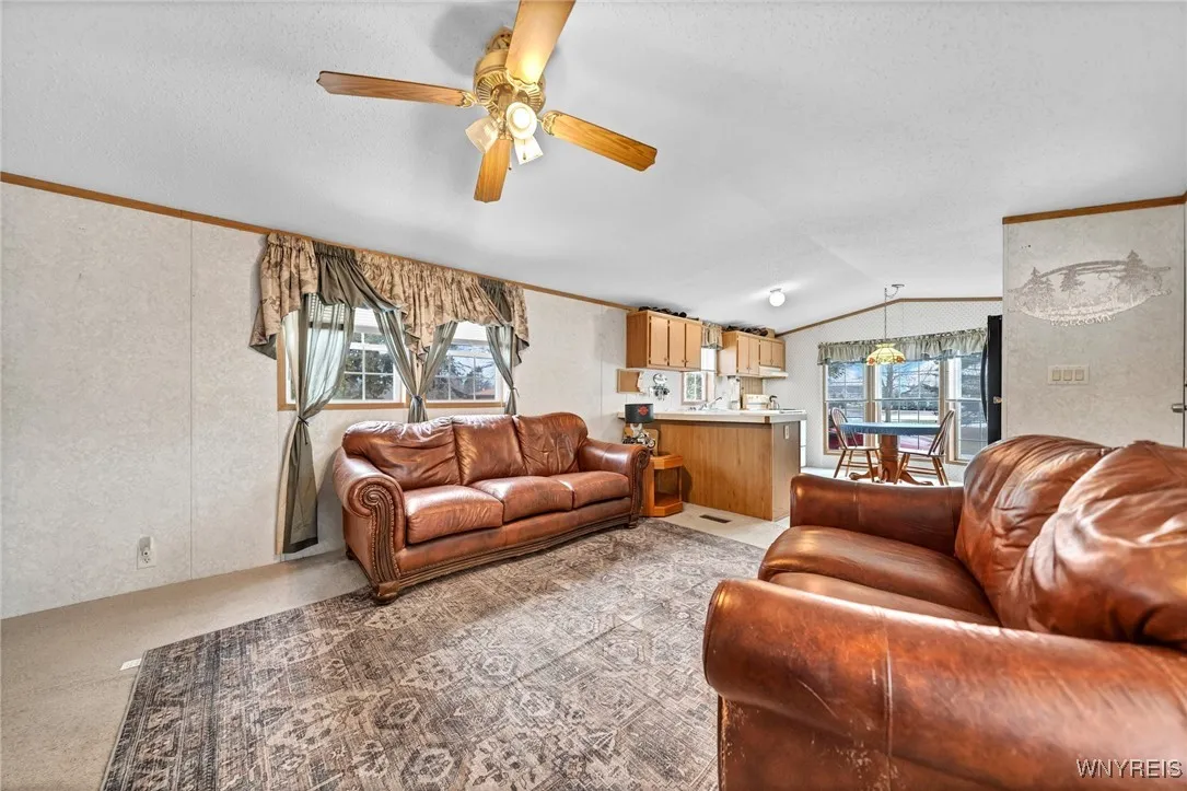 Living room is spacious and comes with furniture too.