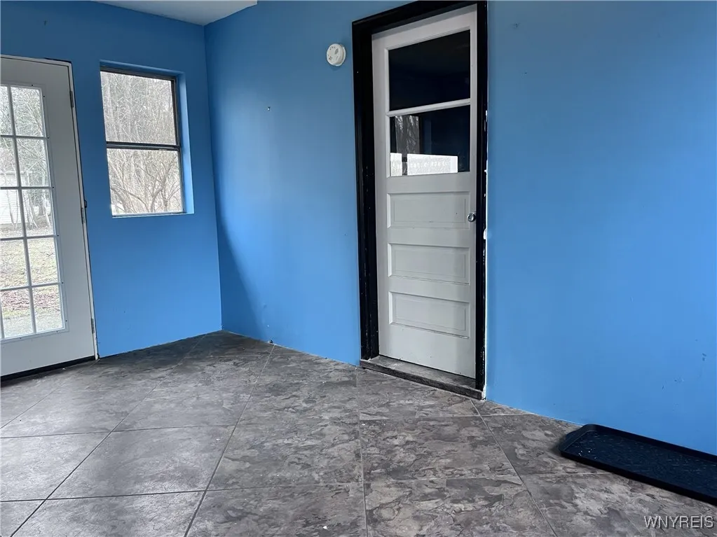 This Breezeway between the garage and the kitchen is the perfect buffer from the cold.