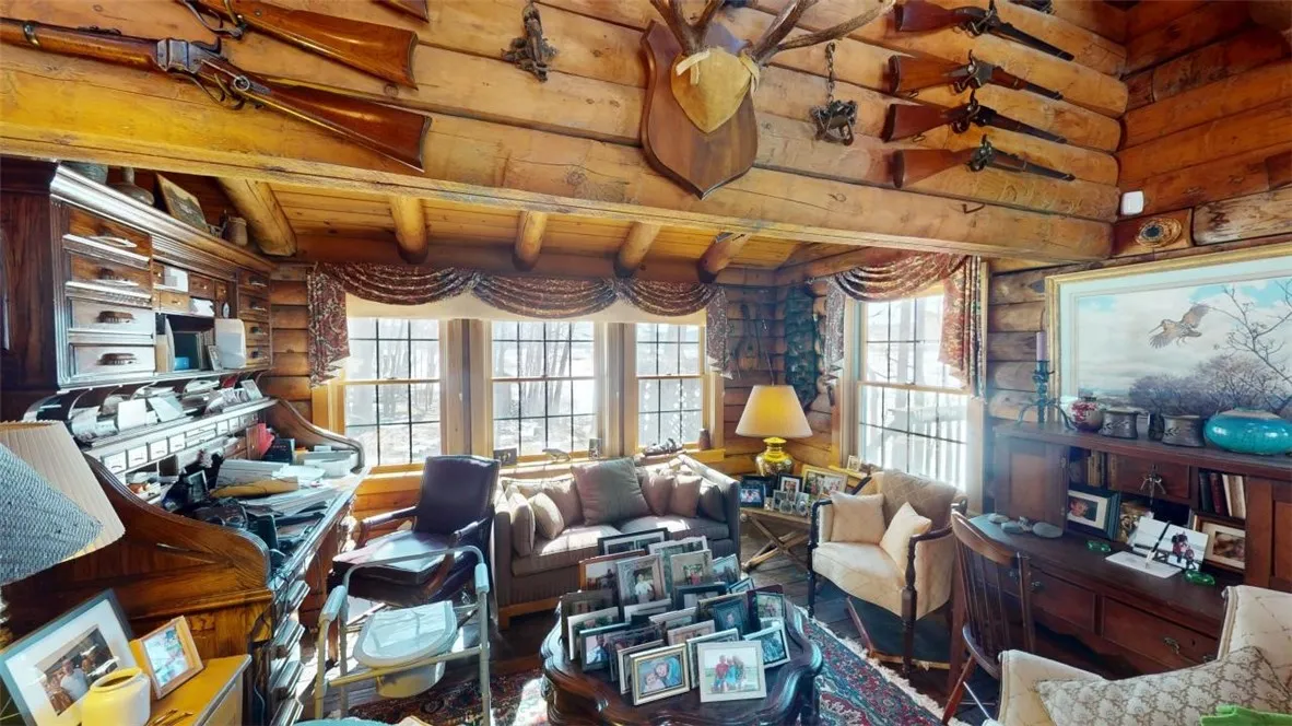 A cozy living room nook ~ full of sunlight and lake views out the windows.