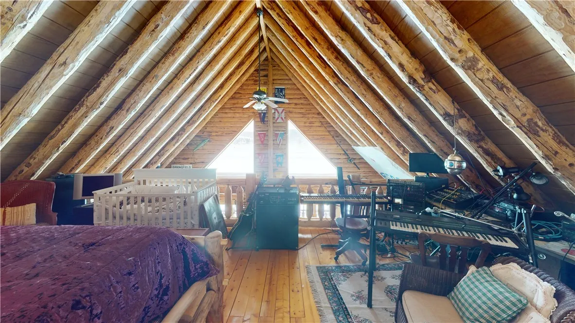 Loft area.  Would easily fit a king bed or two queens.