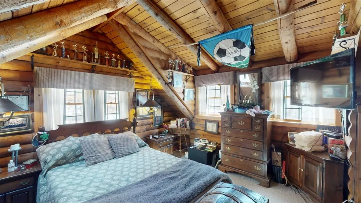 Upstairs bedroom #1 with stone fireplace all to itself!