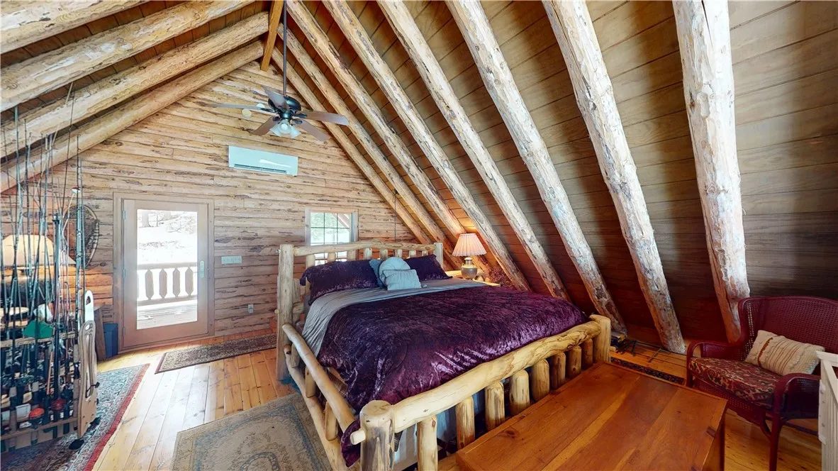 Boathouse loft space with door to rear porch. It feels like you are in the middle of the Adirondacks out here.