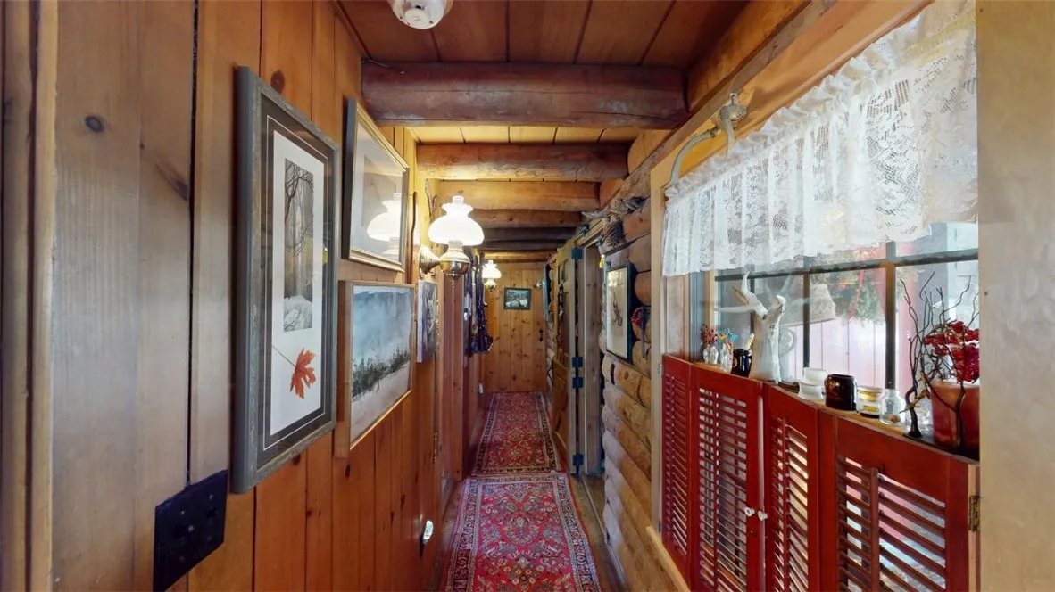 Hallway from kitchen to primary bedroom, entry foyer, half bath, full bath, etc.