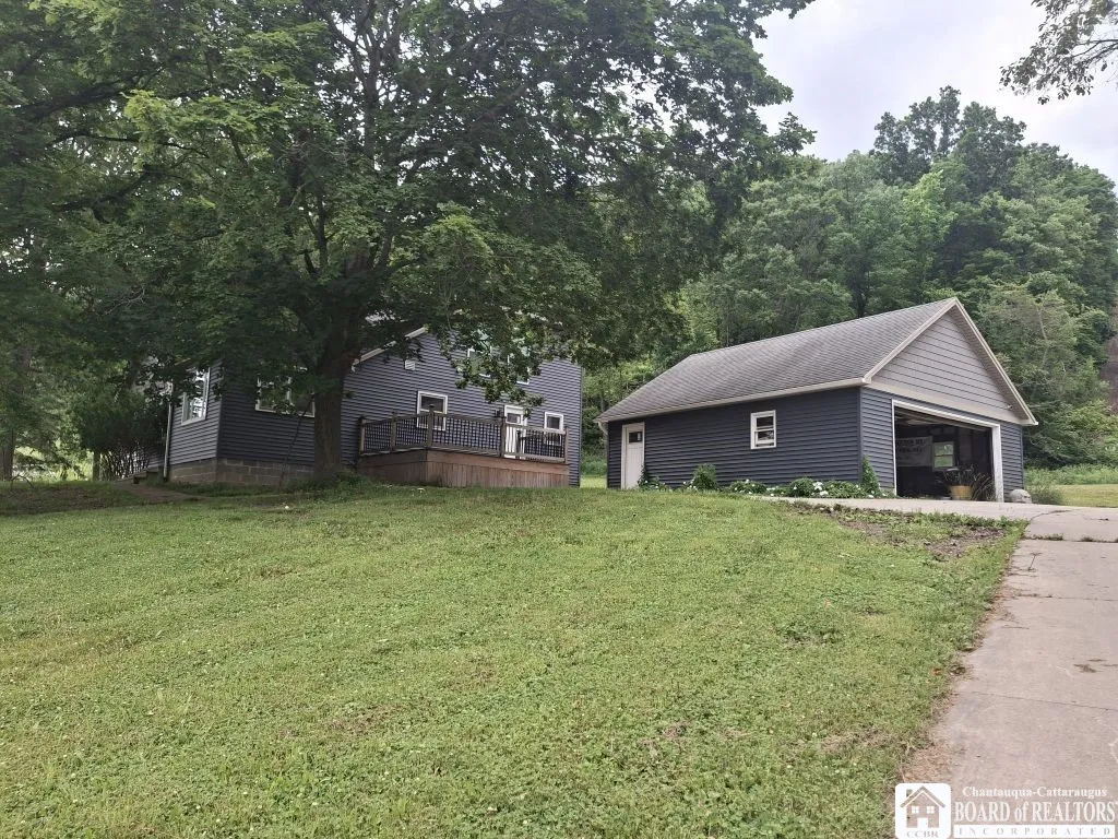 Home sits up off the roadway.
