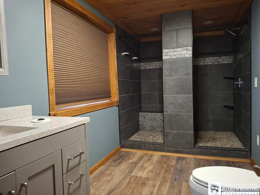 Full bath upstairs with dual showers