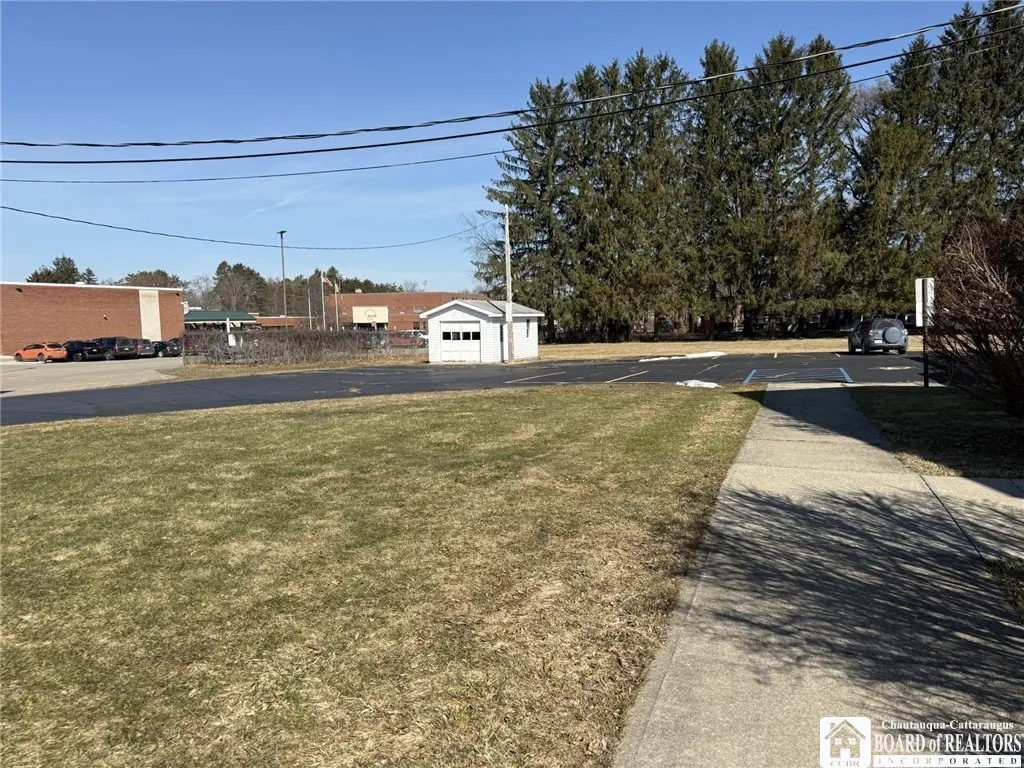 Back paved parking lot and shed