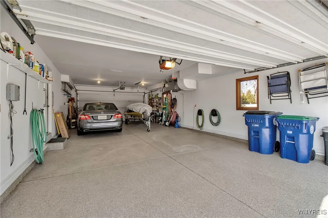4 car garage with epoxy floor and 2nd garage door to yard