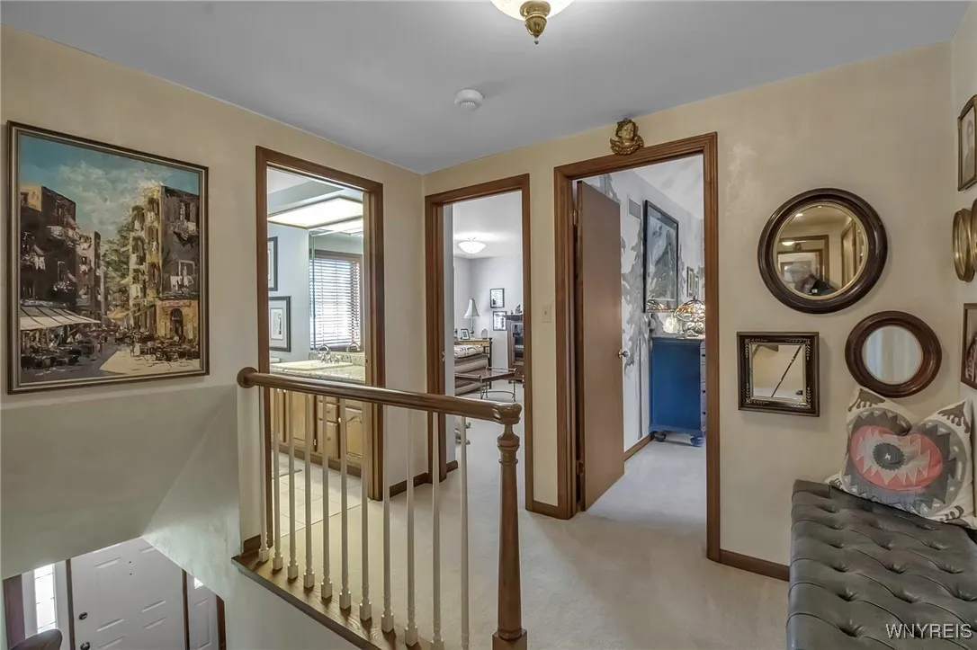 2nd floor staircase leading to full bath, bedroom and ensuite