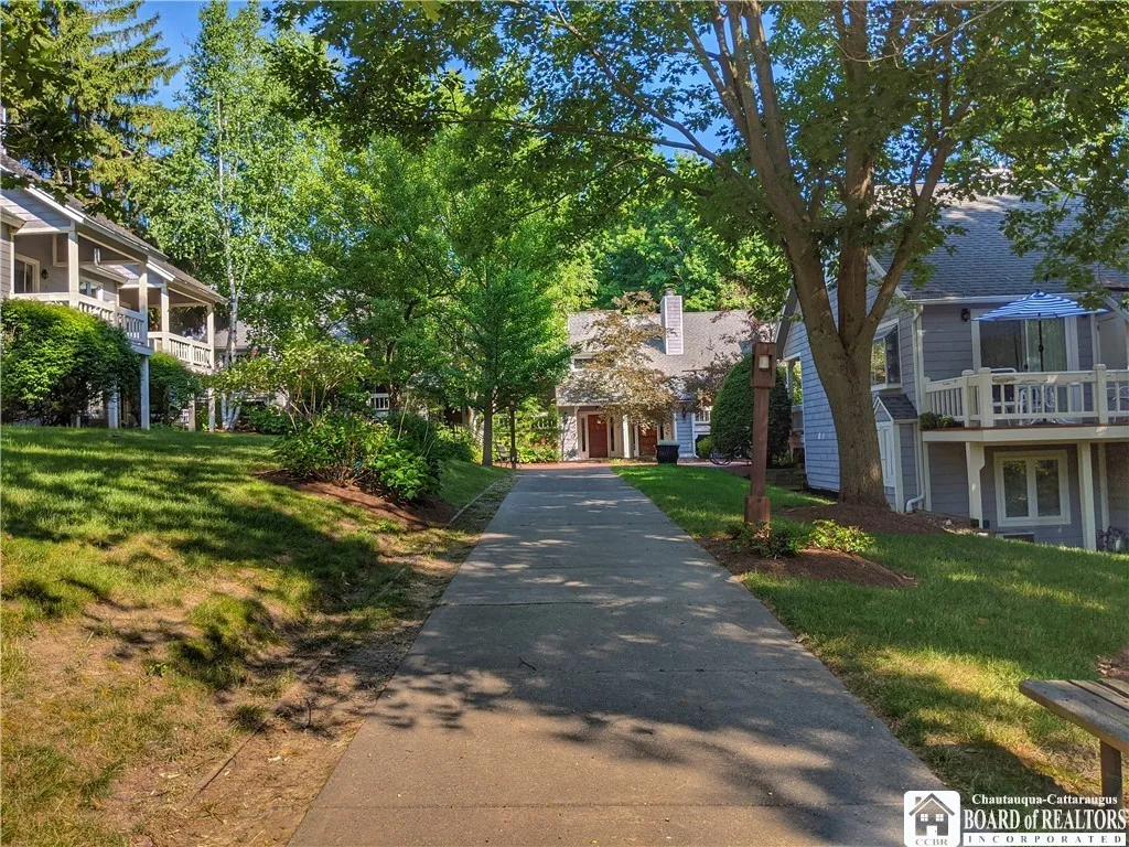 Mature trees, bushes and perennials line the sidewalks