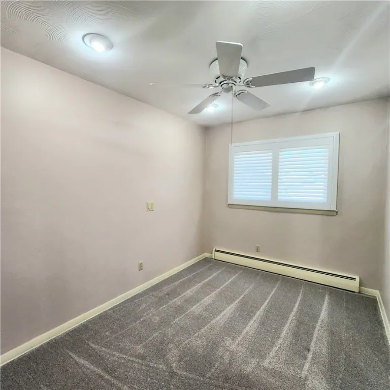 Bedroom has new windows, shutters, carpet, and lighting