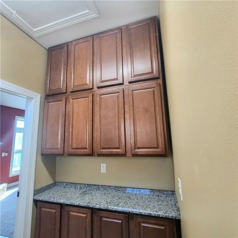 So much storage in the laundry room! Pull down stairs to walkable attic with storage room and attic fan
