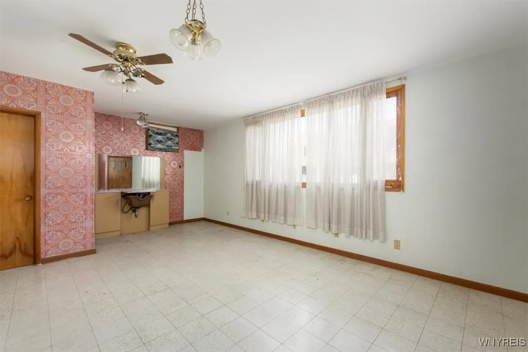 So many opportunities for the use of this extra bonus space.  Measures 13\' x 25\' with a half bath.