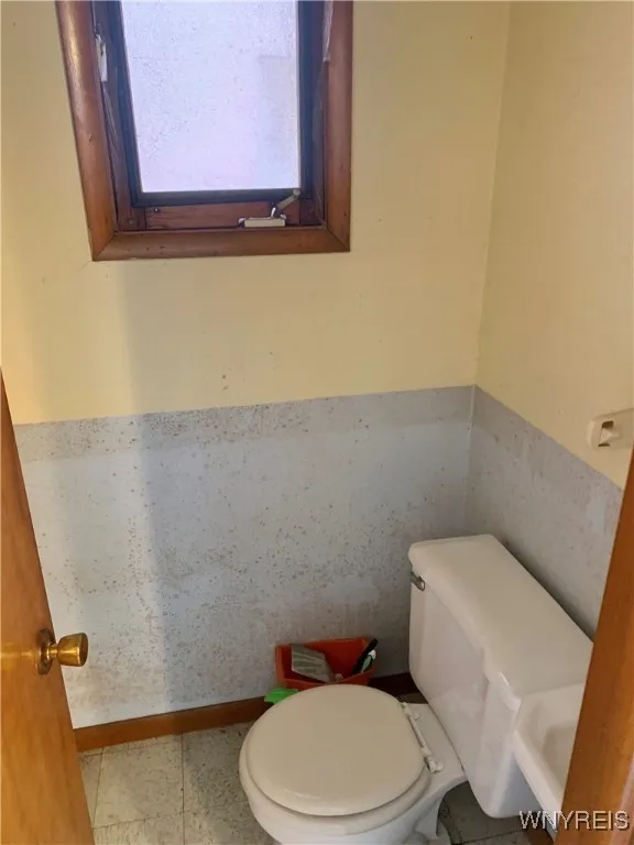 Half bath in the bonus space, former hair salon.