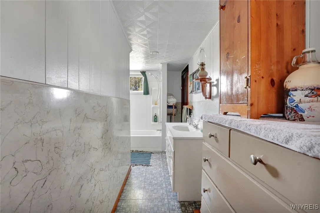 Full Bath Downstairs that connects to Bedroom & has separate entrance as well