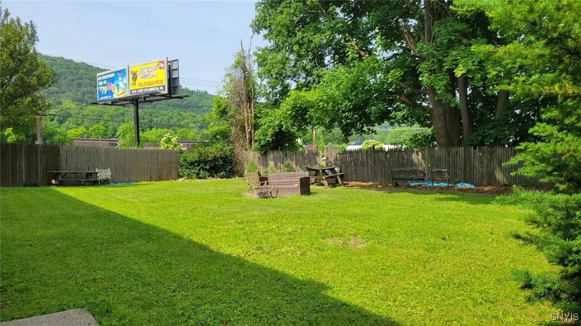 Large partially fenced yard