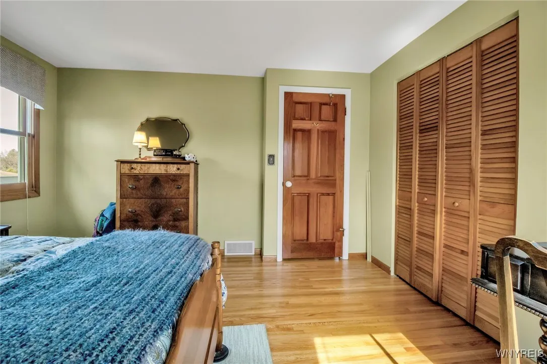 12x12 BDRM w/HW flrs, closet + 6 panel entry dr