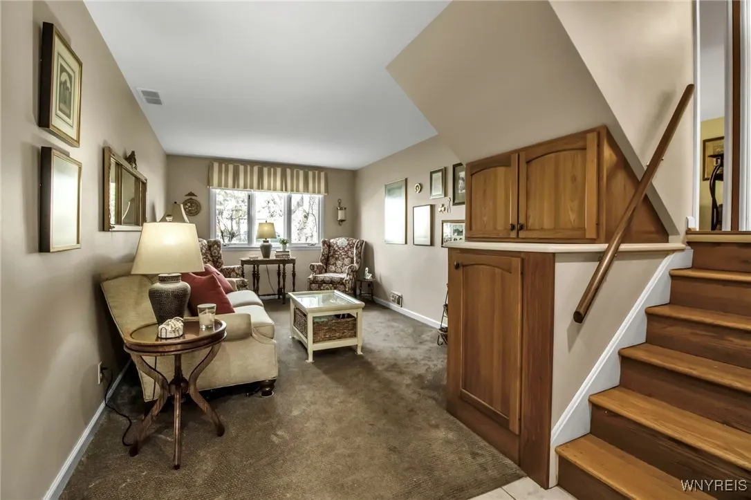 Carpeted Family Rm w/BI storage cabinets