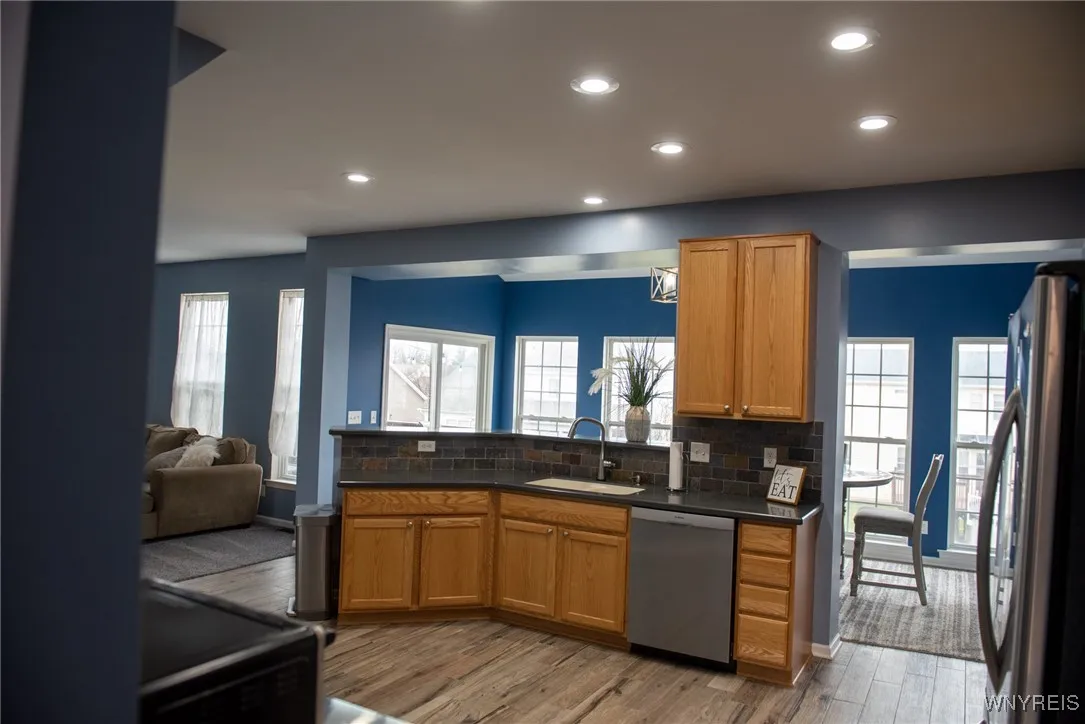 The kitchen is open to the sunroom and the family room