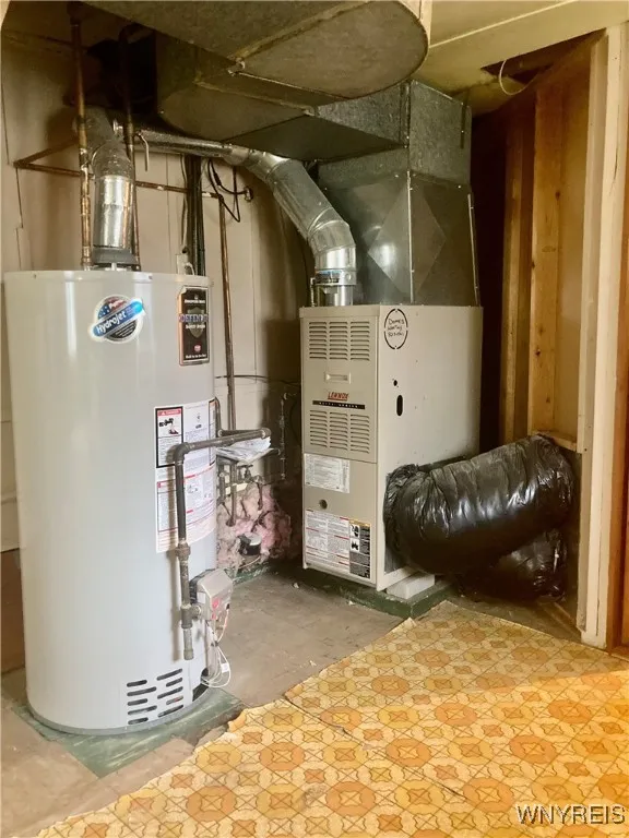 Daylight basement area/mechanicals, laundry & toilet