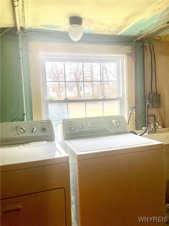 Daylight basement area/mechanicals, laundry & toilet