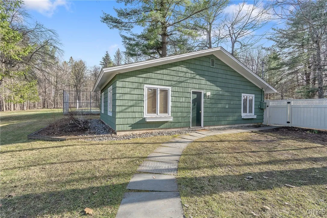 2 Car Detached Garage and Studio. Tennis court behind the garage.