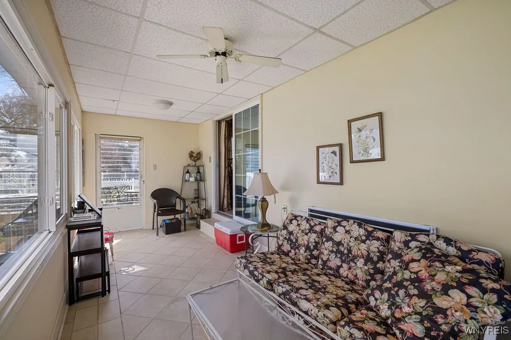 Three season room with tons of brand new windows for natural lighting