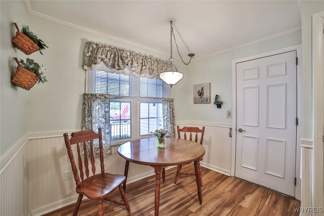 Lovely wainscoting trim in the eating area.  Door leads to the attached garage...not too far to carry groceries!