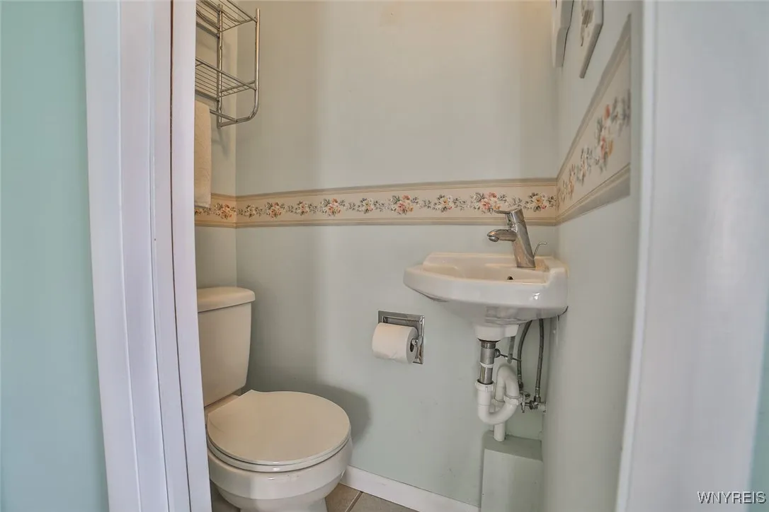 Just such a convenient half bath with pocket door access.