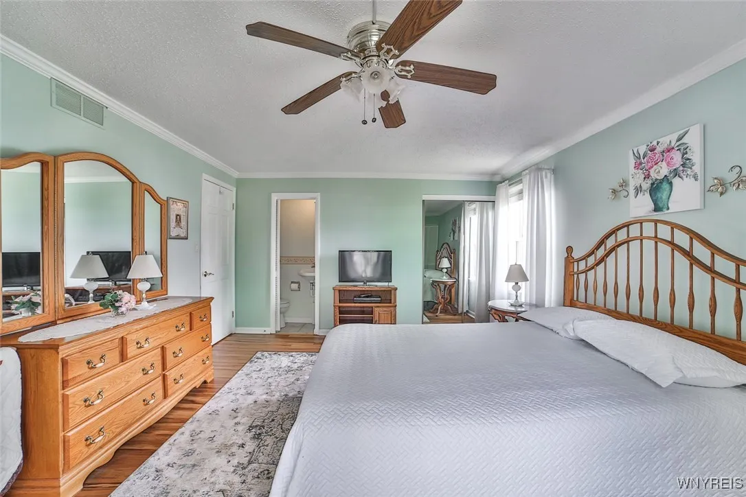 Convenient half bath right in Primary bedroom and mirrored 3rd closet for checking out your outfits!