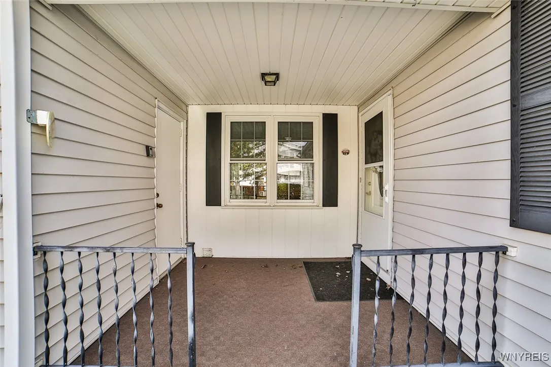 Delightful covered front porch with access to home and garage for your convenience!  Package deliveries are not exposed to the elements!