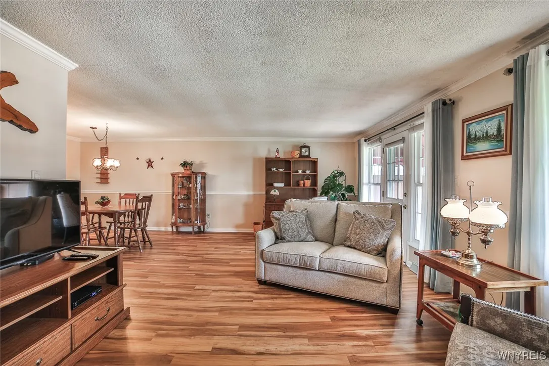 Stunning, newer, (2023) floors throught the home and plenty of sunshine with all the windows.