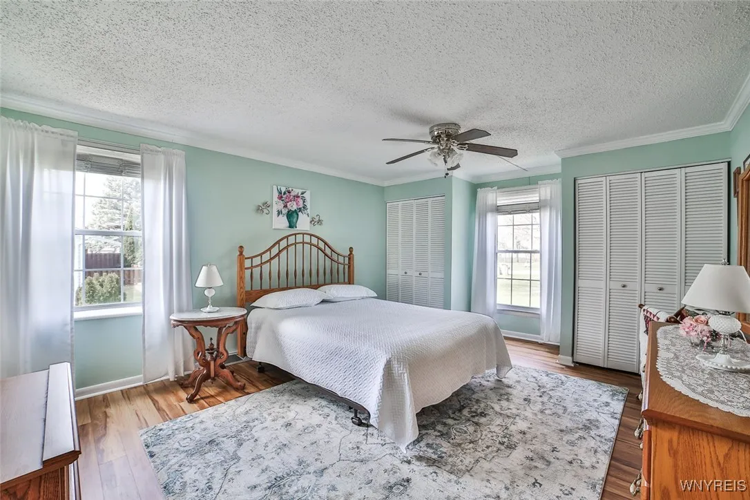 Spacious Primary Bedroom with windows on both sides for added brightness.  3, yes 3, Double Closets too!