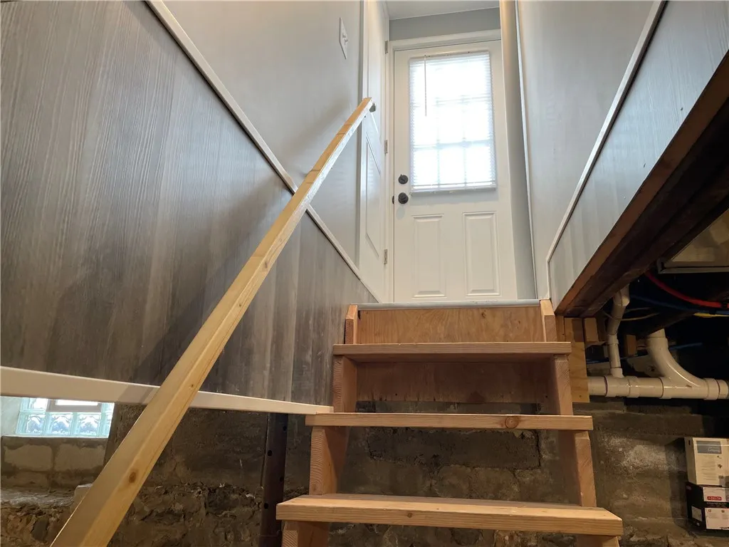 The basement stairs are all new. Looking up at the new back door.