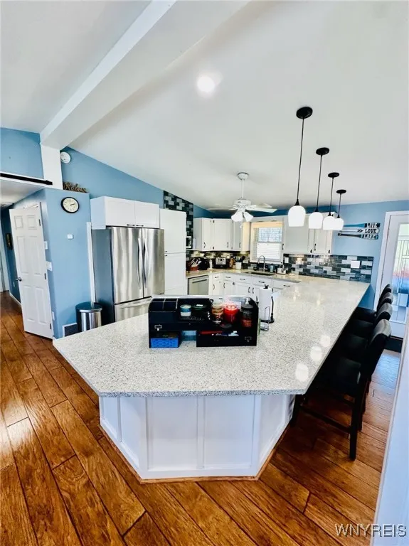Beautiful quartz counters offers space for up to eight stools.