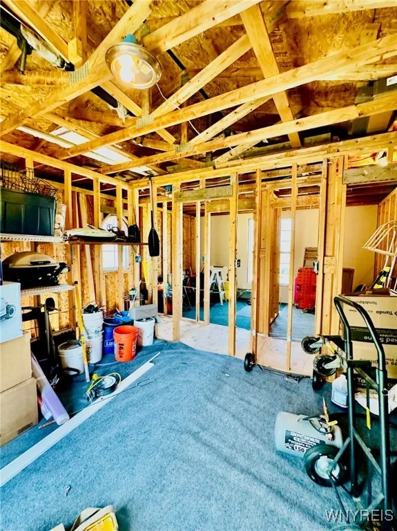 Partially finished area above garage. 2nd floor of garage is sectioned out to three rooms.
