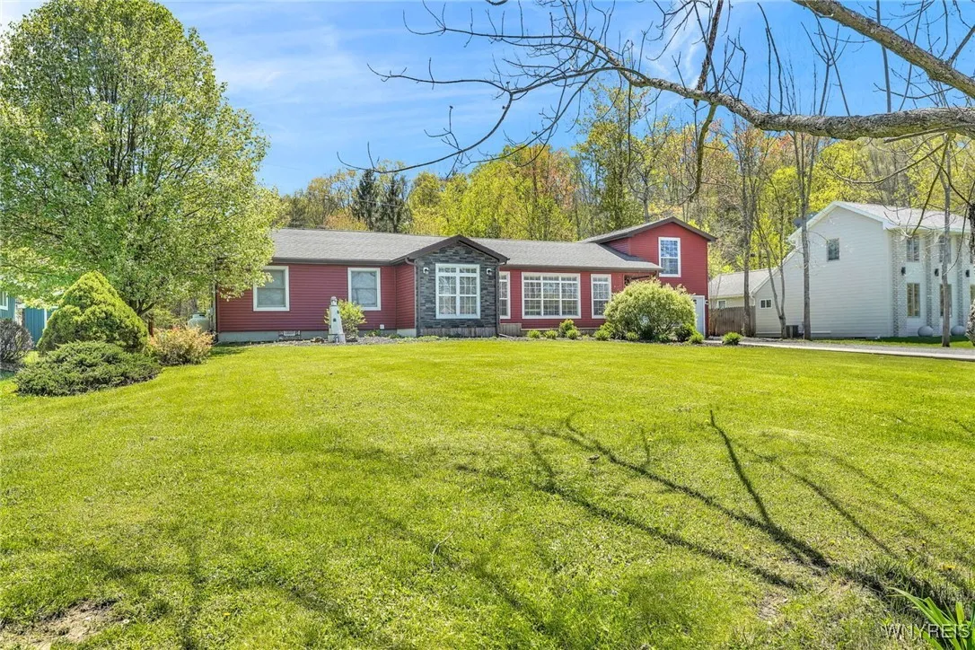 Large yard to enjoy from the front porch; just a block off the lake.