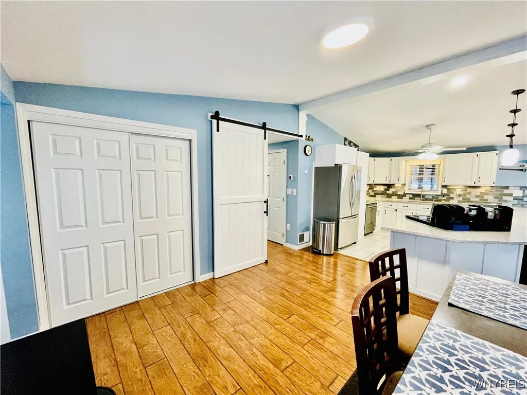 Oversized barn door keeps the living space noise out of the bedrooms.